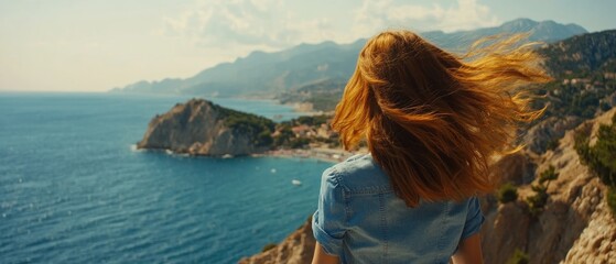 Coastal vista viewed by a person with flowing hair.