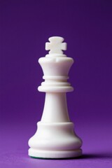there is a white chess piece on a purple background