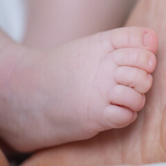 Tiny Toes: A close-up shot captures the delicate and adorable tiny toes of a newborn baby, highlighting the beauty and innocence of new life.