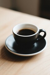 Fototapeta premium there is a cup of coffee on a saucer on a table