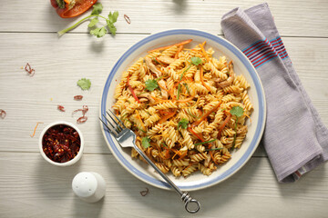 Spicy Vegetable Pasta on Plate – Fusion Asian Style Dish - top view with garnish