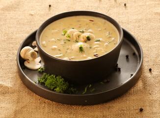 Creamy Mushroom soup with black bowl