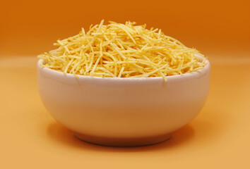 STRAW POTATOES IN A WHITE BOWL