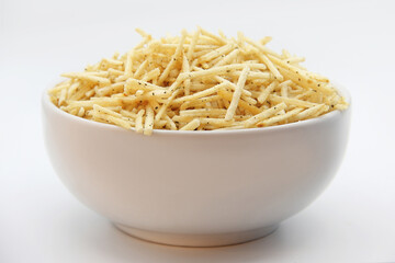 STRAW POTATOES, ONION AND SEASONED PARSLEY IN A WHITE BOWL