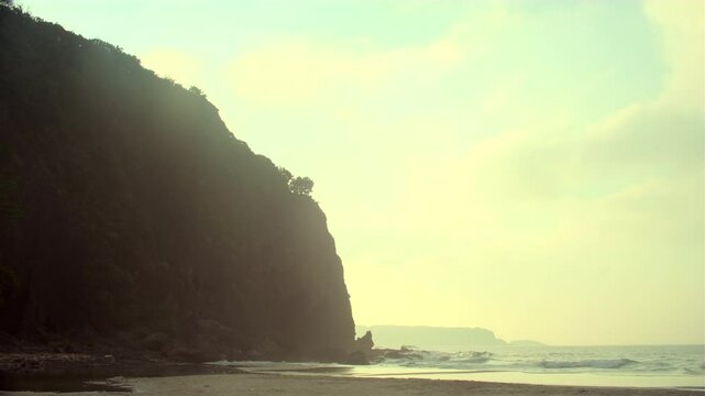 Waves and Warmth at Japanese Coast
Gentle waves roll under glowing light on a tranquil beach in Japan&mdash;perfect for themes of solitude or reflection.