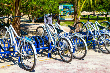 Bicycle Bicycles bike bikes parked at the beach entrance Mexico.