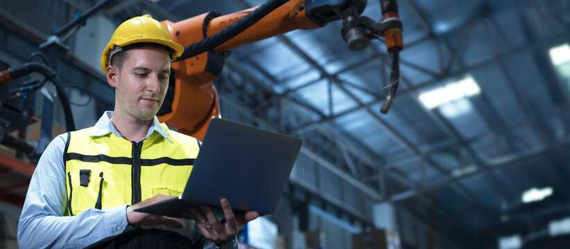 professional engineer, robotic technician work in modern factory industrial robot welding arm advance machine wide banner concept