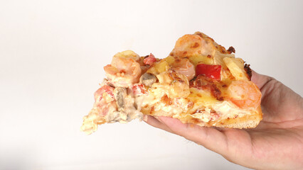 Hand is hold a pizza on white background.