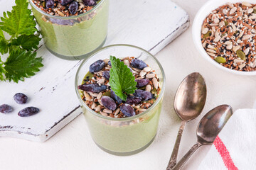 Healthy eating, lifestyle, veganism, alkaline diet, vegetarian concept. Green smoothies from nettle...