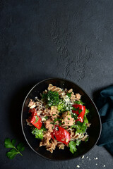Whole grain pasta salad with tuna and vegetables. Top view with copy space.