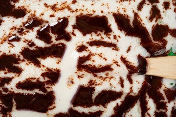 top view melted chocolate outer with milk and blueberry flavors popsicle