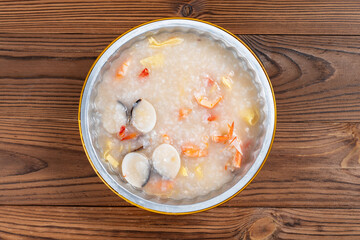 top view fresh shrimp and clams porridge at horizontal composition