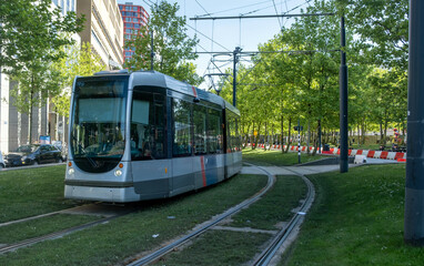 Naklejka premium Tram in Rotterdam city, public transportation, sunny day in Netherlands Holland