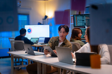 Group of young Asian Software Developers Talk,Discuss a Technological Project prompt app program...