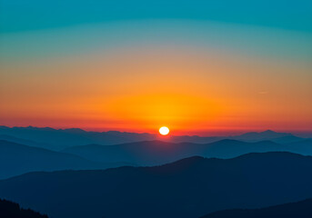 Obraz premium beautiful mountain sunset with orange and blue gradient sky 