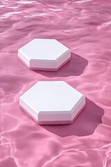 Two hexagonal white soap bars resting on a vibrant pink surface. surrounded by bubbles. creating a fresh and clean aesthetic. ideal for beauty or skincare product promotion