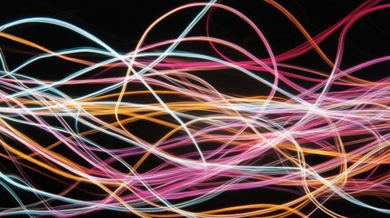 Abstract digital art piece that appears to be made up of multiple lines of light trails in different colors.