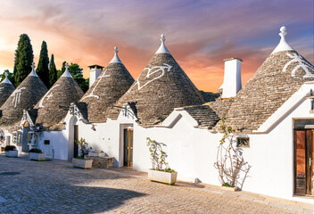 beautiful touristic view of white mediterranean buildings in old medieval Italian style of trulli...