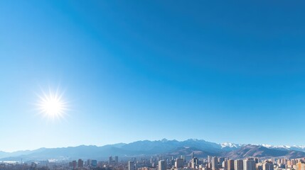 Fototapeta premium Cityscape view from above with snow capped mountains