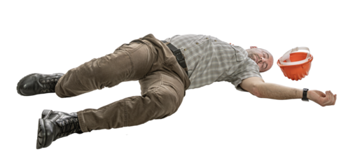Construction worker unconscious on the ground isolated