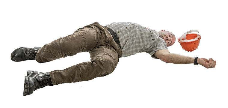 Construction worker unconscious on the ground isolated