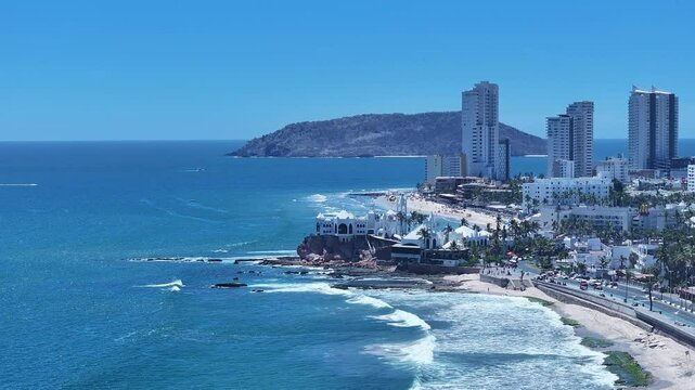 Aerial Mexico Mazatlan city sandy beach. Commercial ocean vacation tourism seaport, cargo and cruise ships. Luxury resort Mexican Riviera. Romantic destination. Sand, surf and beach recreation travel.
