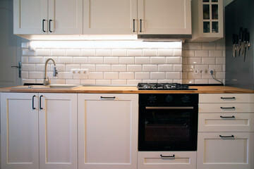 A beautiful kitchen detail with white cabinets