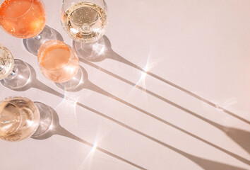 A close-up of glasses with alcoholic beverages. Cups with colorful sparkling wines from different grape varieties