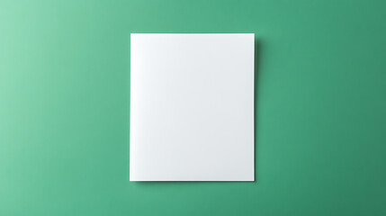 Crisp white paper on a refreshing green backdrop. Perfect for showcasing your designs. Clean, minimalist, versatile. Inviting canvas for creativity.