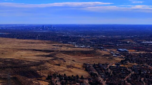 Lookout Mountain Golden Colorado aerial drone Downtown Denver cityscape from North Table Mesa daytime winter sunny clouds neighborhood Front Range Rocky Mountains Arvada Lakewood circle right motion