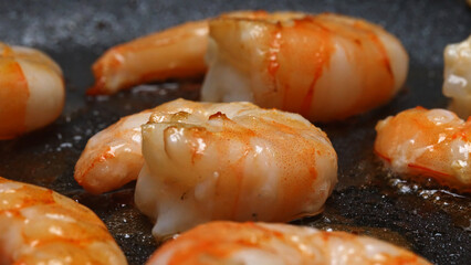 Raw Peeled Shrimp Frying in Hot Skillet Pan.