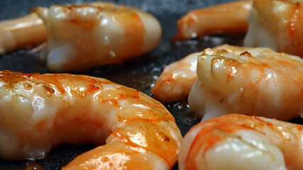 Raw Peeled Shrimp Frying in Hot Skillet Pan.
