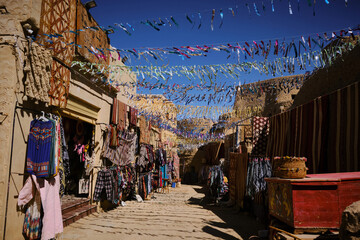 Traditional berber clothes and souvenirs on the souk in Shali fortress. Street bazaar at Siwa oasis, Sahara desert, Egypt
