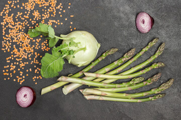 Kohlrabi and green asparagus on the table