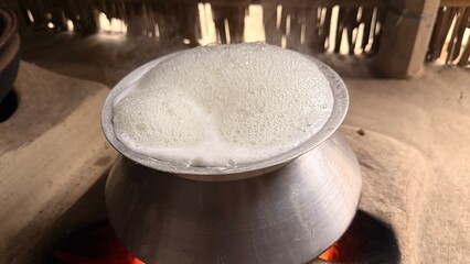 Naklejka premium Cooking Pot Over Open Fire