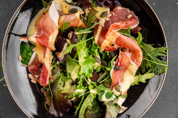 Salad jamon meat green leaf lettuce appetizer food fresh gourmet food background on the table...