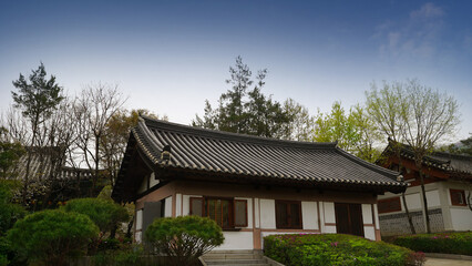 Traditional Korean Hanok Village with Wooden Houses and Tiled Roofs