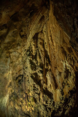 A close-up view of a limestone cave, filled with colorful,curious,wonderful. Lighting enhance texture and geological beauty.