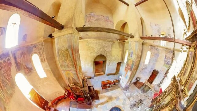 Prnjavor, Serbia, Sept 2,2024:Wide angle 360 view in the interior of Ljubostinja monastery church with its many frescoes and iconostasis in Serbia. Church is known for its well preserved medieval art