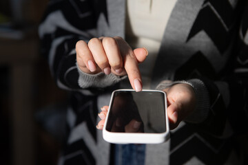 woman holding phone