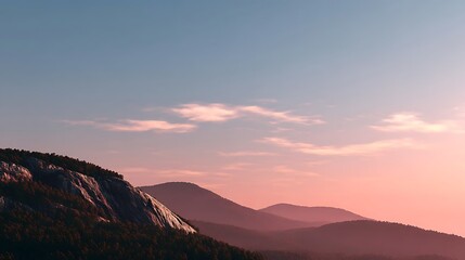 Tranquil Mountain Ridge Under Soft Pink Sunrise Sky with Serene Landscape and Gentle Light Reflections