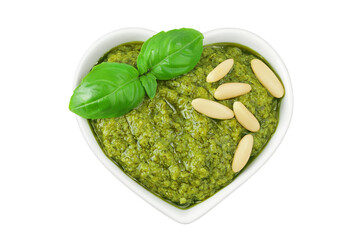 Pesto sauce in ceramic bowl isolated on white background. Top view. Flat lay.