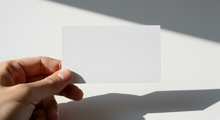 Blank Card Mockup on Dark Wooden Surface with Minimalist Setup