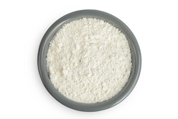 White flour in ceramic bowl isolated on white background. Top view. Flat lay.