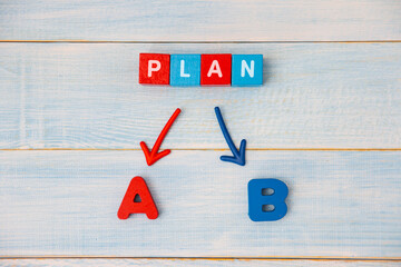 Red and blue wooden blocks with the words Plan A and B