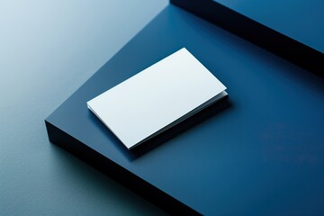 Blank white bifold brochure mockup resting on a modern blue surface, perfect for showcasing your design
