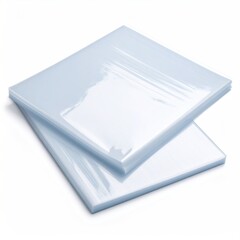 Stack of transparent plastic sleeves for document protection on a white background.