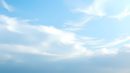 A serene gradient background displays soft blue hues blending seamlessly with wispy cloud formations.