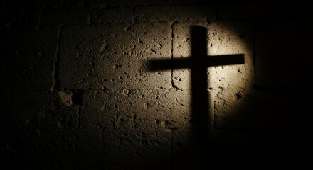Cross shadow on stone wall