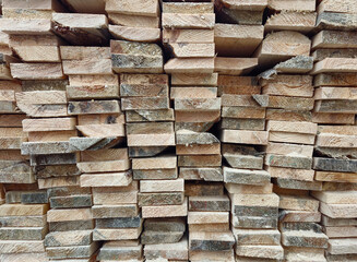 Stacked Wooden Logs Arranged in Neat Horizontal Alignment Close-Up